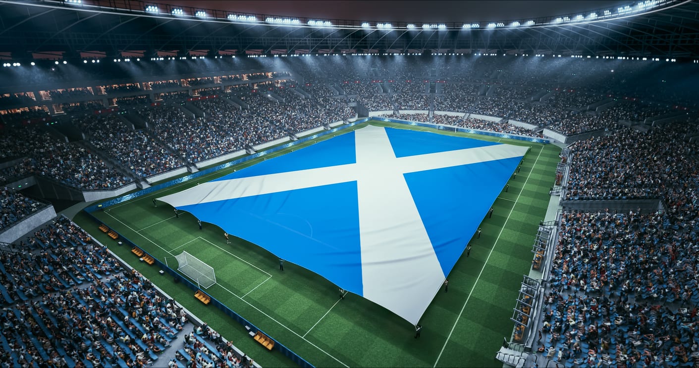 Stade de rugby illuminé avant un match, drapeau géant déployé sur la pelouse