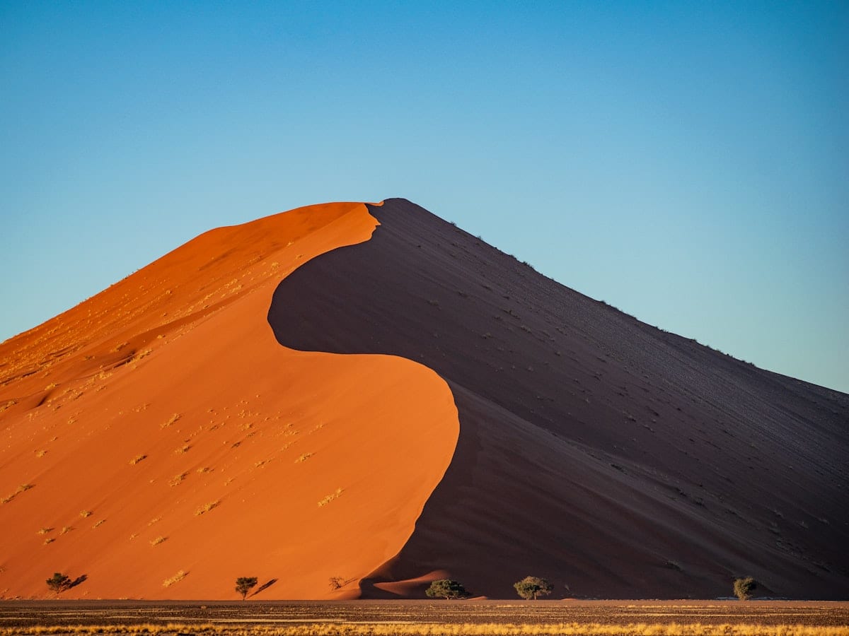 a large sand dune in the middle of a desert