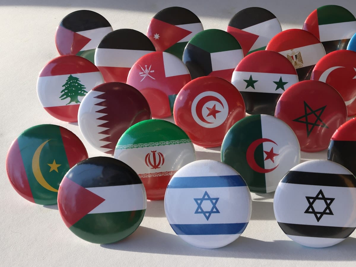a bunch of different colored balls with flags on them