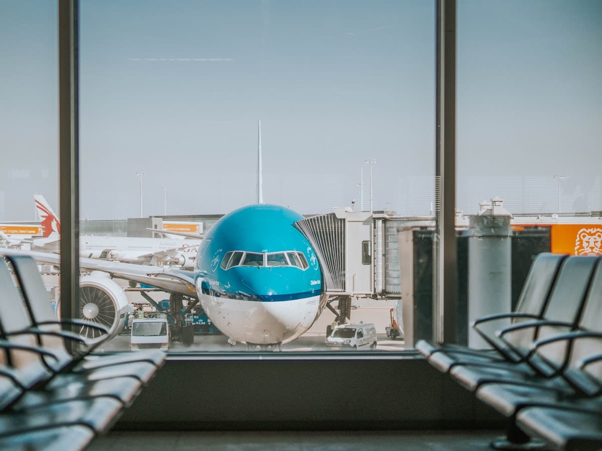 airplane parked near passenger pathway