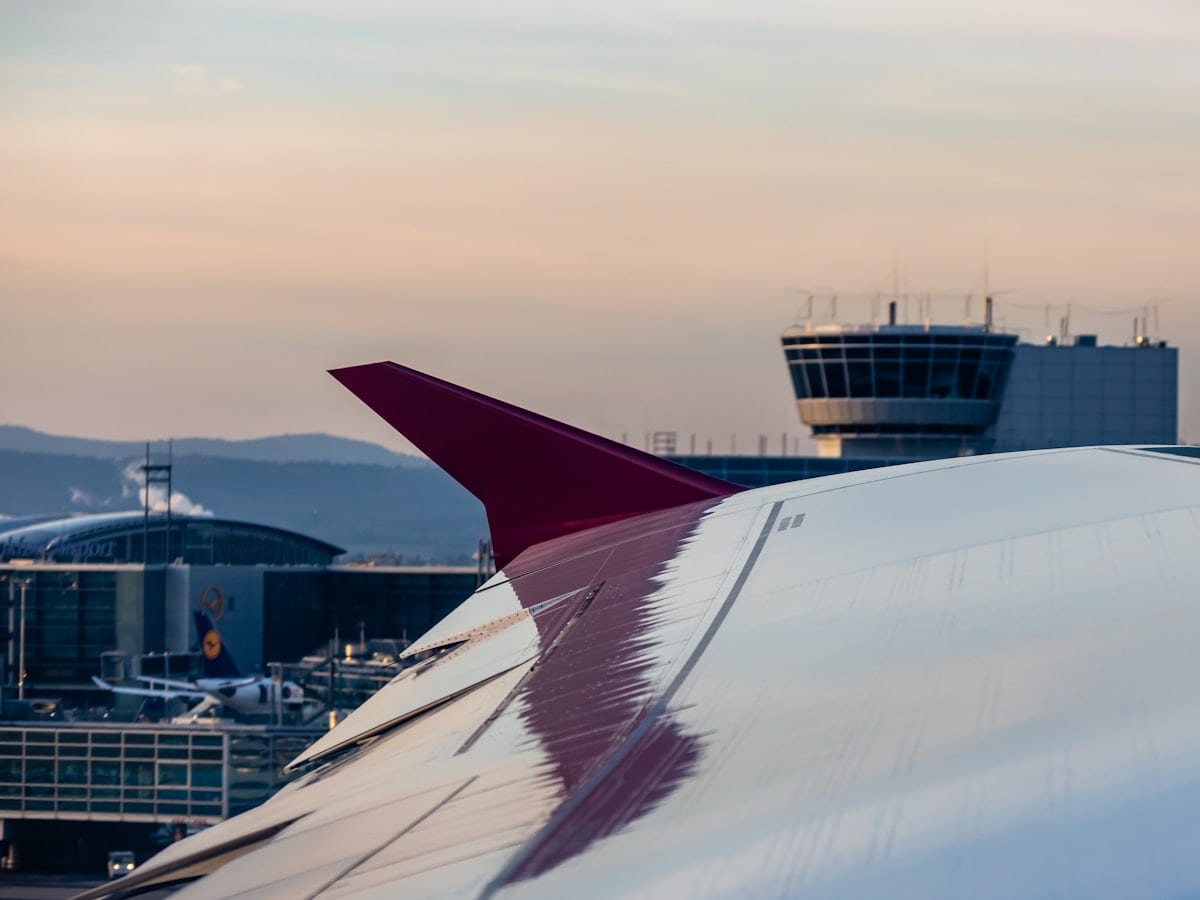 white and red airplane wing
