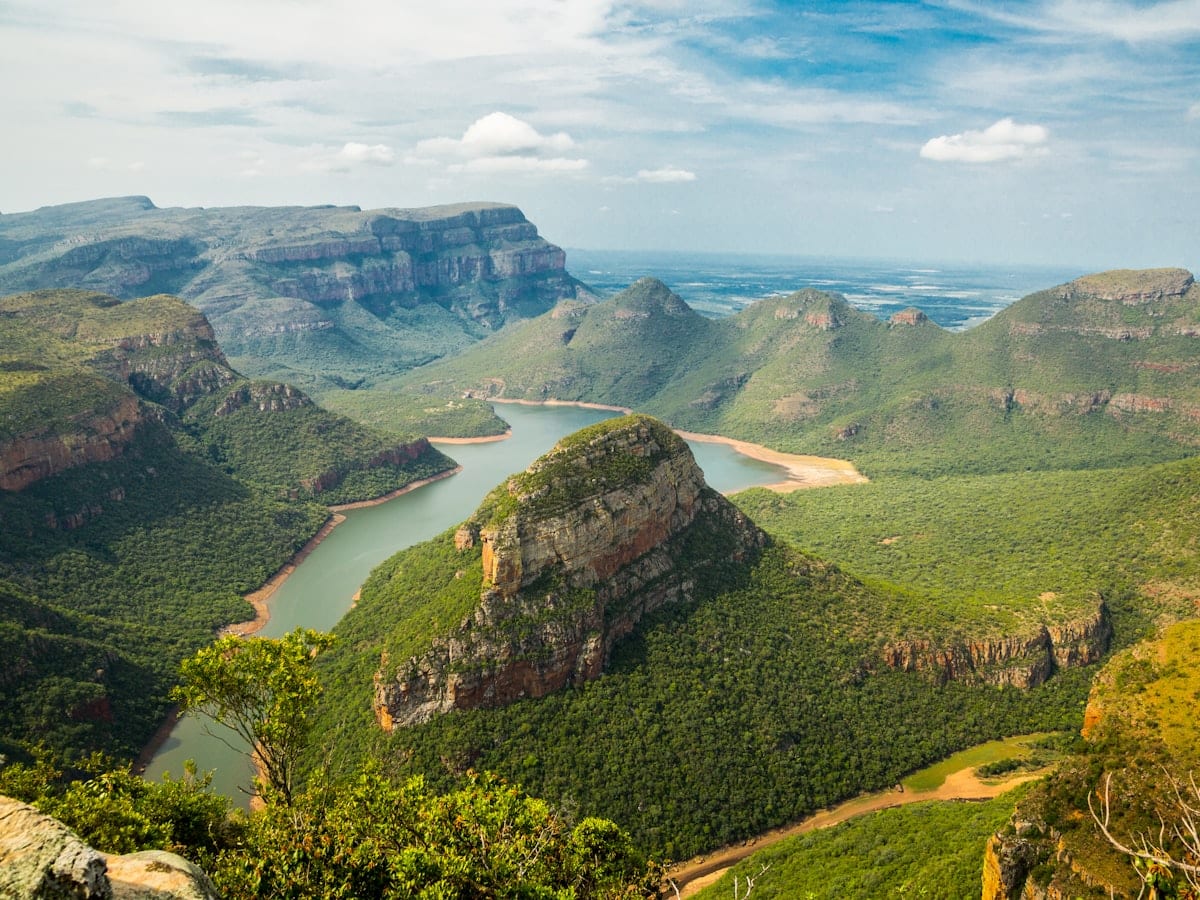 landscape photography of mountains under blue sky