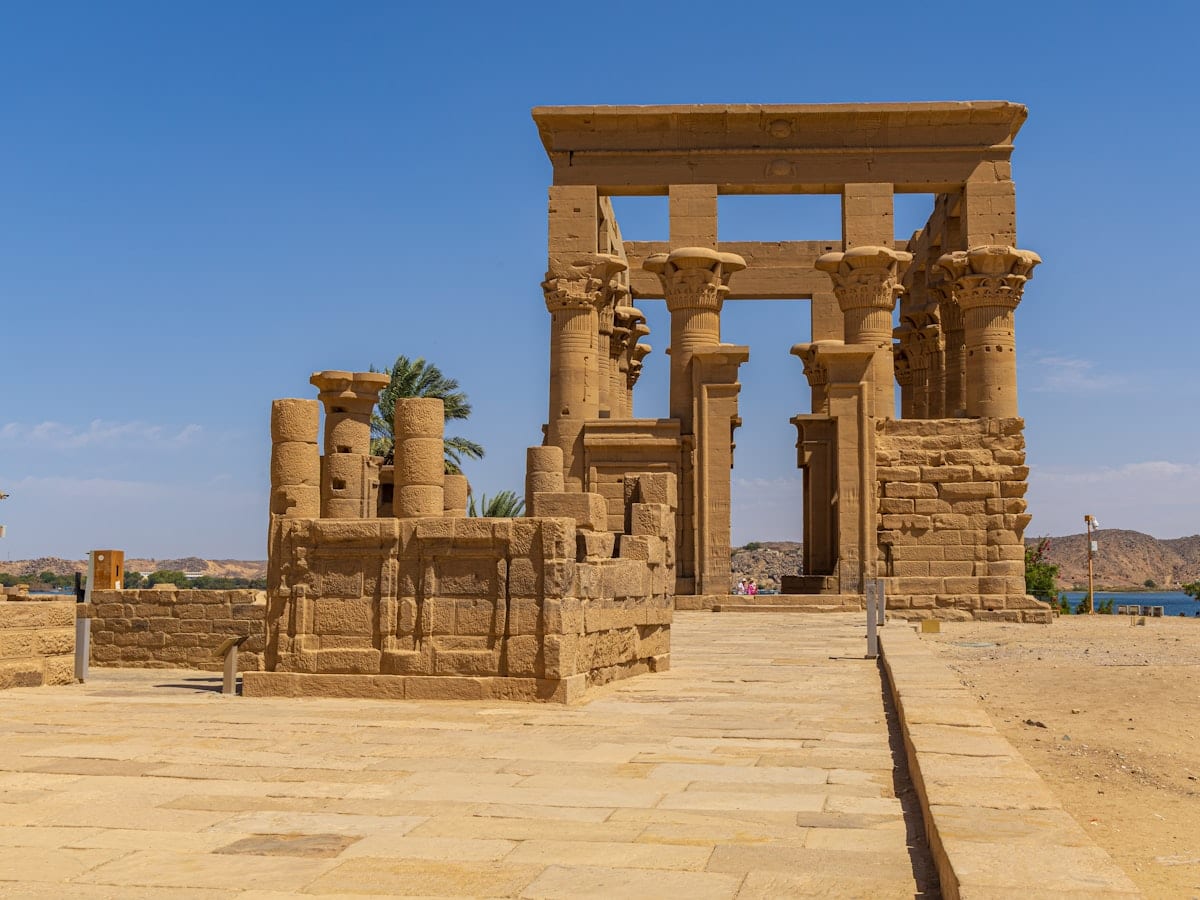 Ancient egyptian temple ruins under a clear blue sky