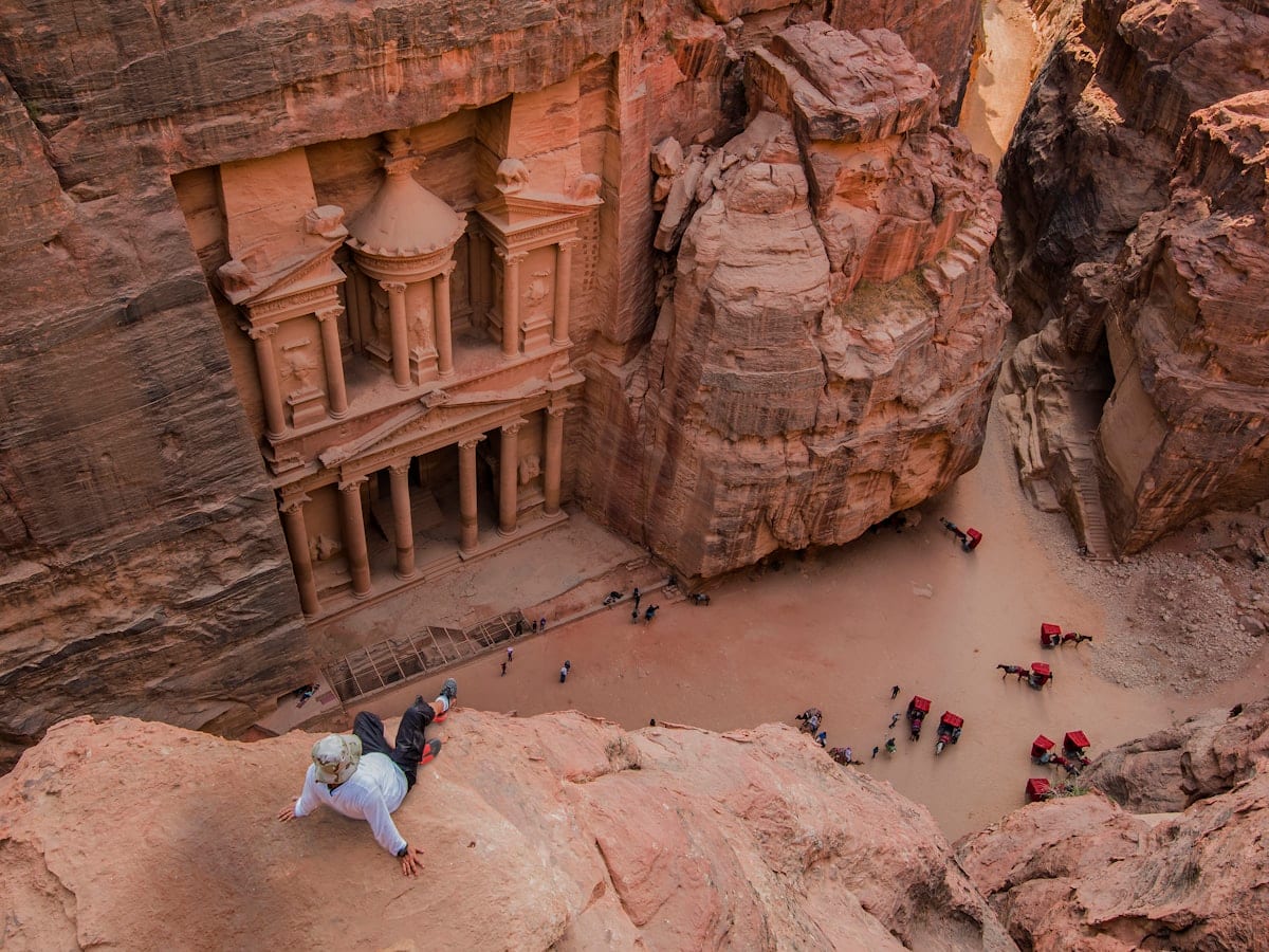people walking on brown rocky mountain during daytime