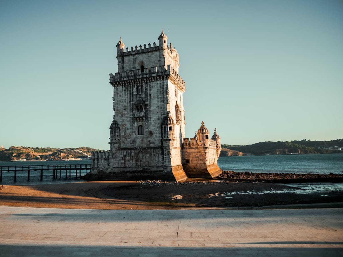 a tall tower sitting next to a body of water