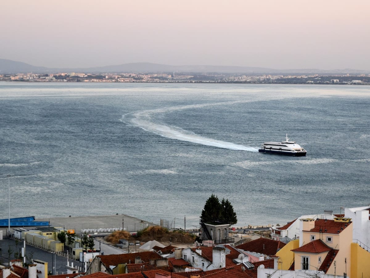 a boat traveling across a large body of water