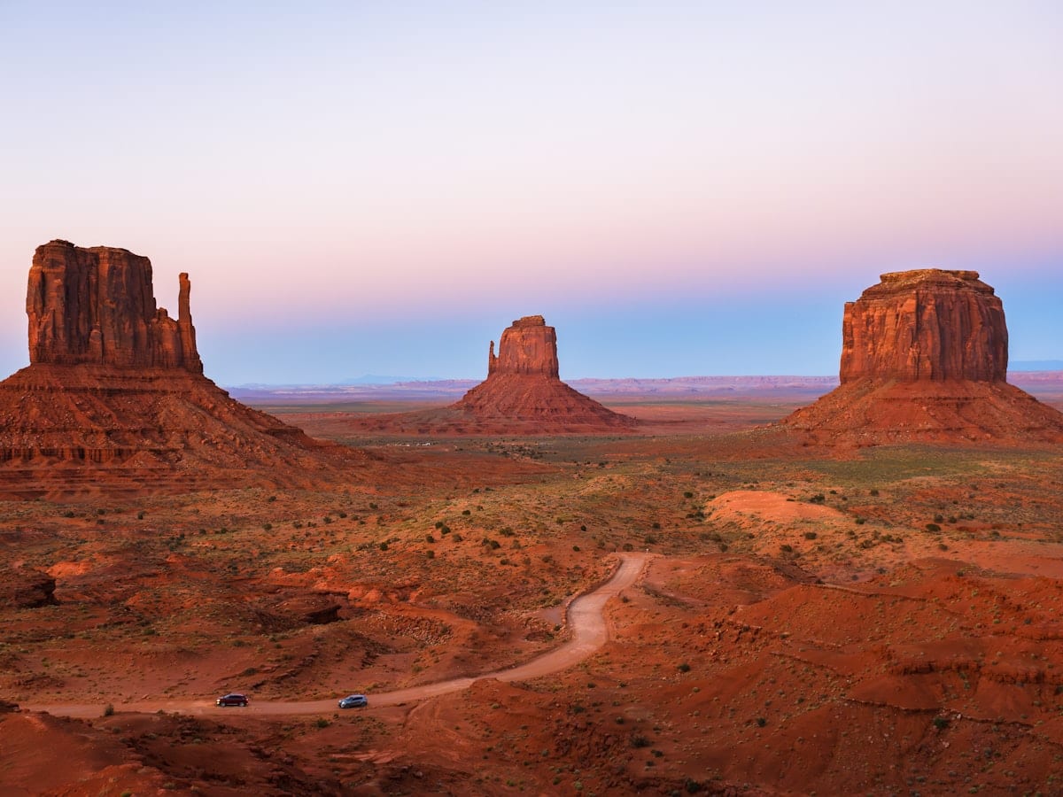 a dirt road in the middle of a desert